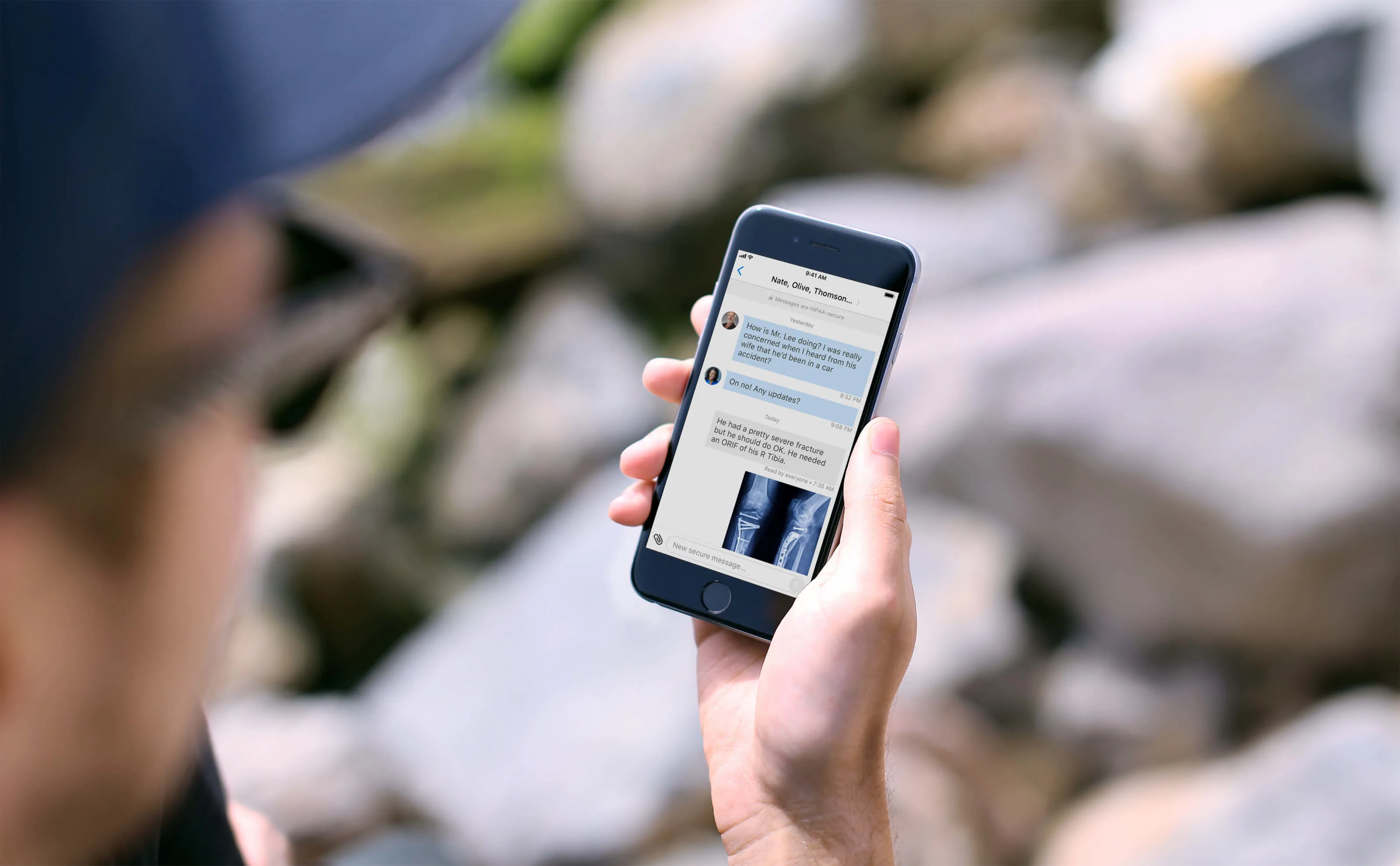 A man looking at the Doximity app on a cell phone